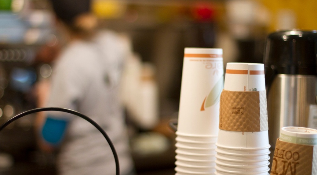 Stacks of paper cups near coffee dispensers in the Quiet Cafe.